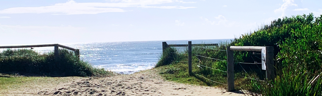 Entrance to Seven Mile Beach in NSW, Australia on a sunny morning